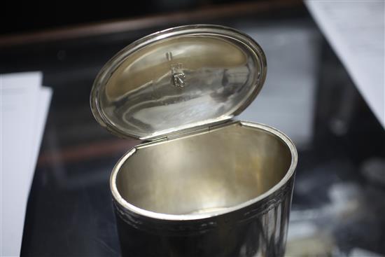 A George V 18th century style silver oval tea caddy, 13 oz.